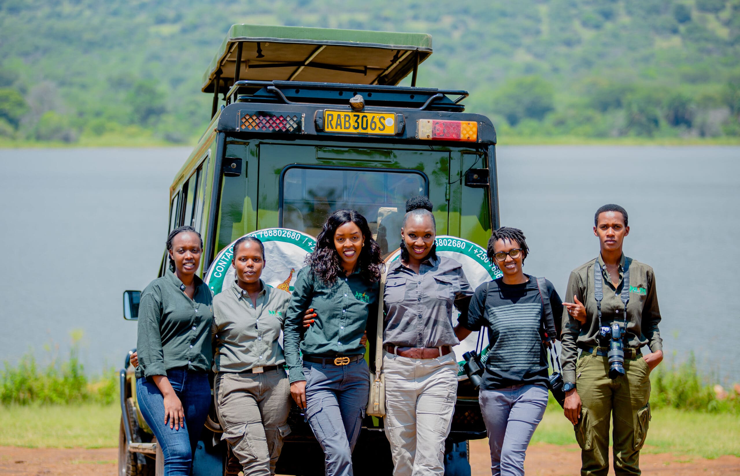 Judith Uwimana (third from right), the founder and CEO of Judith Safaris and her team posing for a group photo in Akagera National Park, Rwanda.